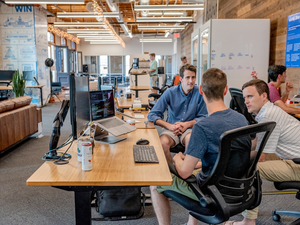 Team coordinating e-commerce operations at a shared workspace